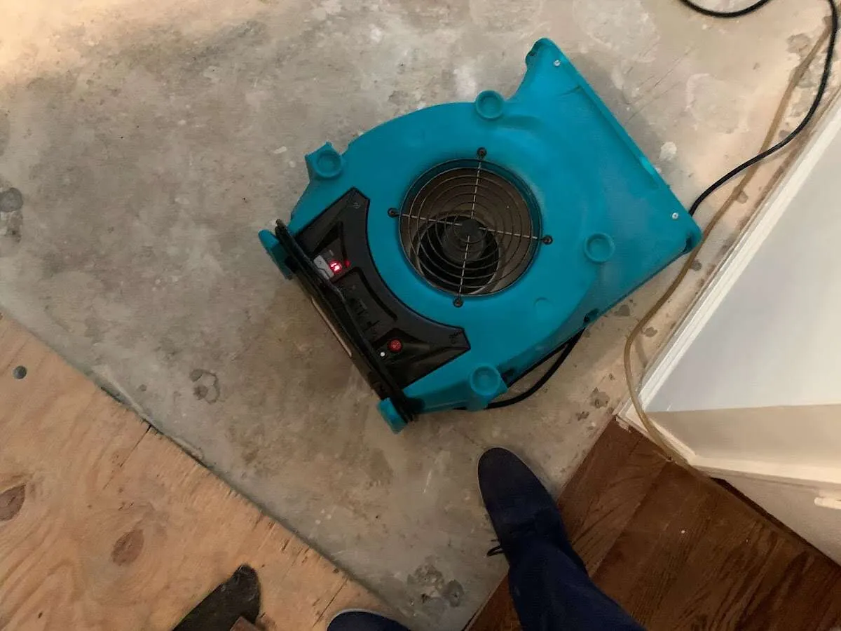 Air mover drying subfloor during Leak Detection & Repair in Rapid City